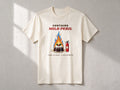 Contains Mild Peril T-shirt – flat lay, Natural