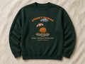 Spooky Season (Light Drizzle Expected) sweatshirt – flat lay, Bottle Green