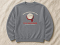The Heating Stays Off Till November sweatshirt – flat lay, Steel Grey