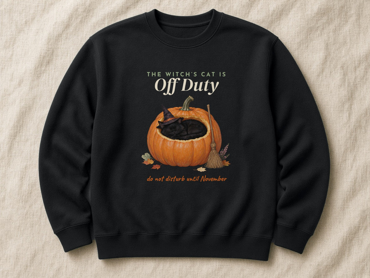 The Witch's Cat Is Off Duty sweatshirt and T-shirt – flat lay, Black sweatshirt