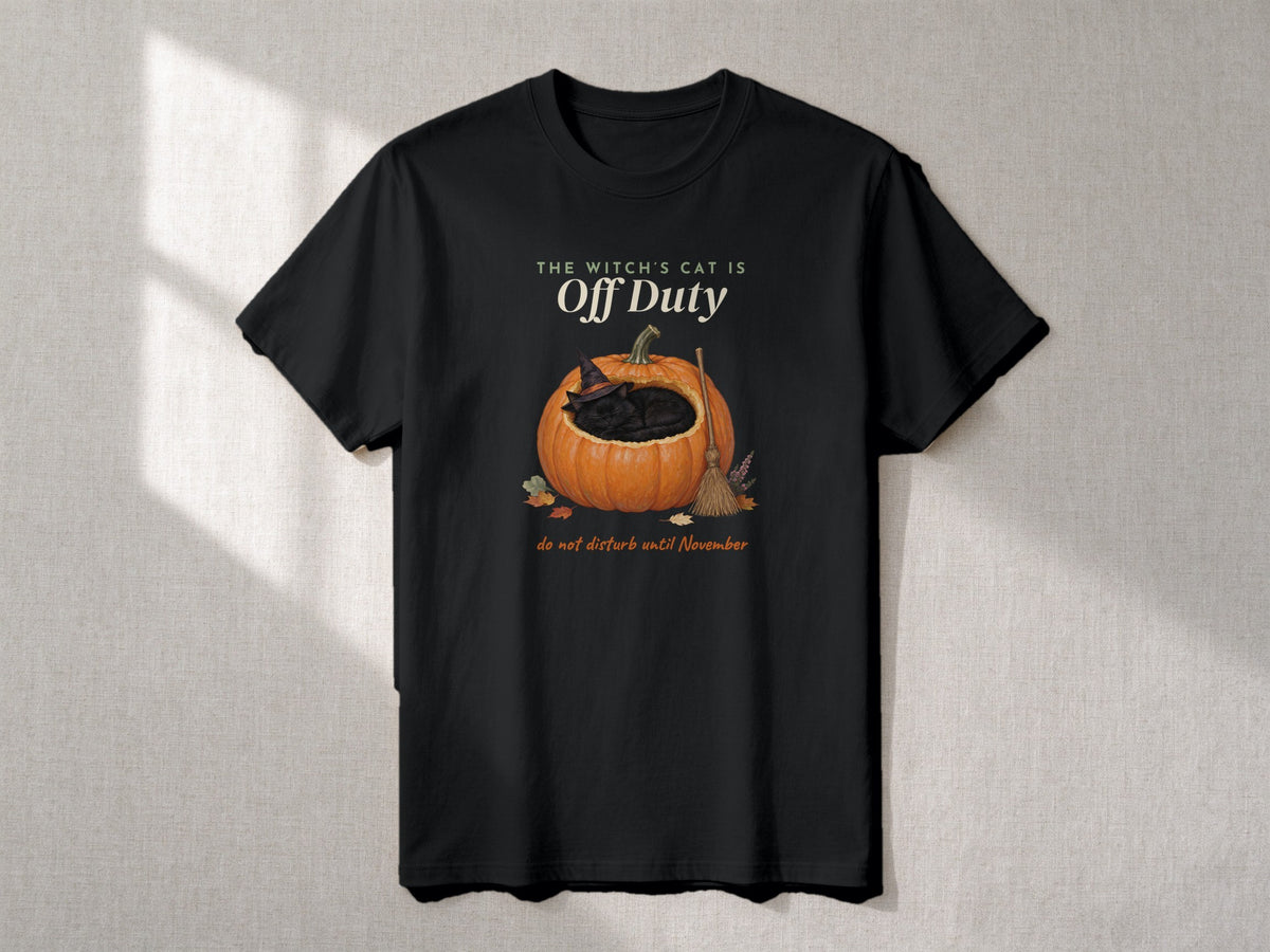 The Witch's Cat Is Off Duty sweatshirt and T-shirt – flat lay, Black T-shirt